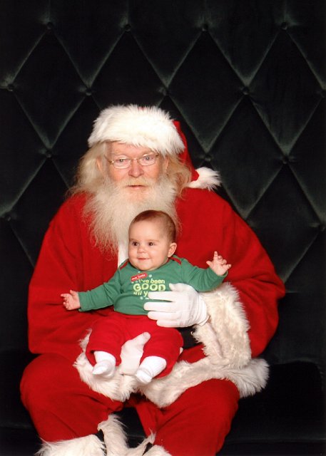 Santab.jpg - Catherine enjoying her visit with Santa.  (Santa stated that the screaming actually takes place during the child's 2nd Christmas ...)