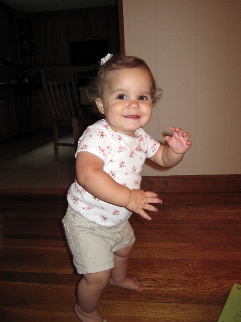 IMG_9507b.jpg - She's making great strides in walking.  (And the first barrette in her hair.)