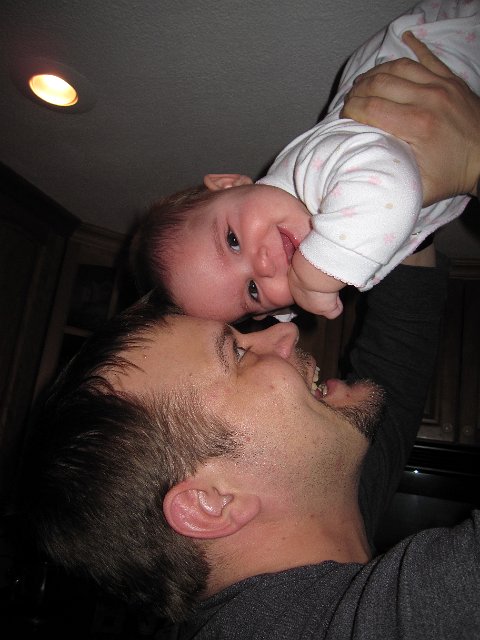 IMG_7008.JPG - She's flying high in the sky with a little help from Dad.