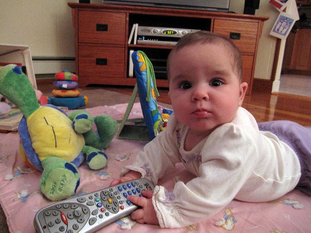 IMG_4999b.jpg - Yes, she is her father's daughter ... the remote is never far from reach.