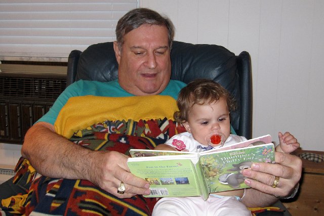 IMG_9408b.jpg - Catherine is enjoying some story time with Grandpa.