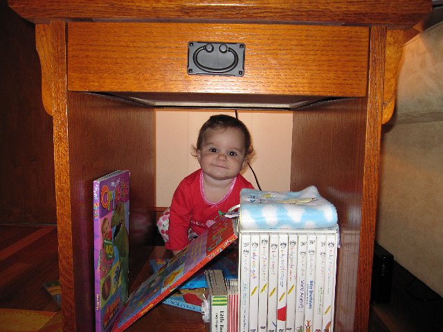 IMG_8453.JPG - Busted having fun once again with her books!