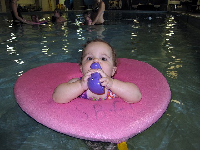 IMG_8111b.jpg - The purple whale is her favorite pool time pal.