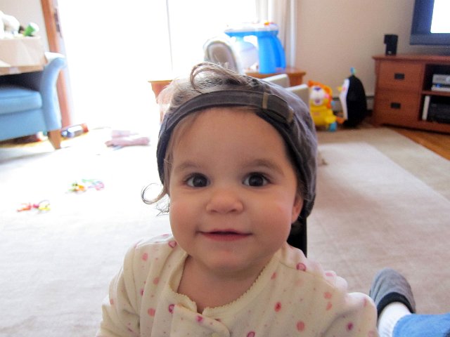 IMG_0547b.jpg - Cute girl!  She was strutting around the house with Daddy's hat.