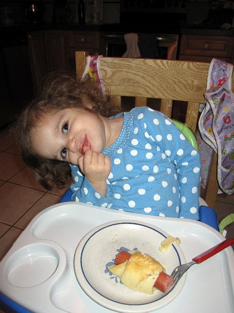 IMG_2086b.jpg - Catherine being silly with her first fancy crescent-wrapped-hot-dog and after all our efforts, she ate only the hot dog.