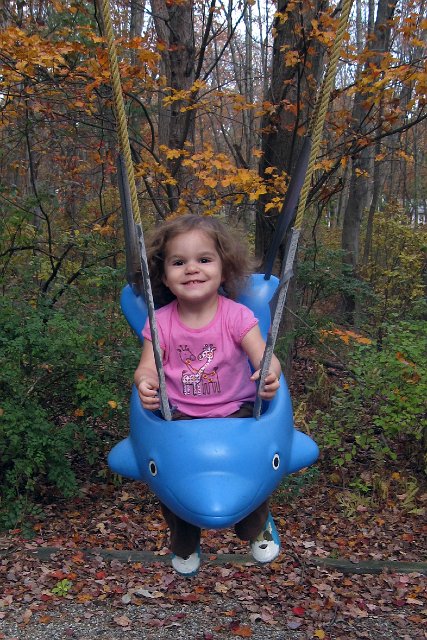 IMG_1934b.jpg - And she's still able to squeeze into the dolphin swing to enjoy the beautiful day.