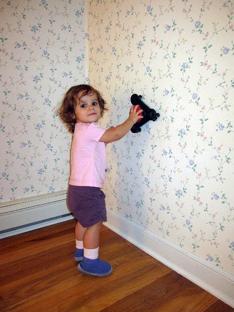 IMG_1375b.jpg - Catherine is assisting with the demolition of the guest room to prepare for her Big Girl Room.  Say bye-bye, wallpaper.