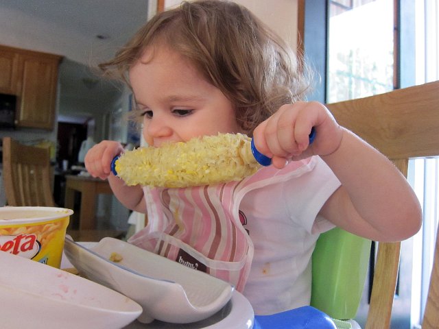 IMG_2213b.jpg - She wanted to dive into the corn like the big people do, so here she is.