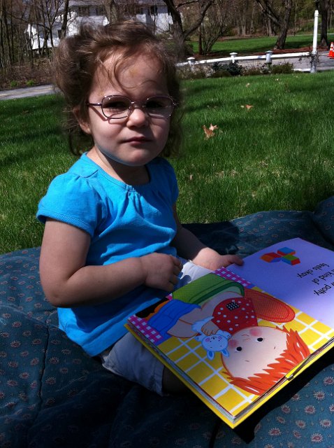 IMG_0773b.jpg - We had to enjoy the beautiful day by throwing a comforter in the front yard and read (while Mommy raked the yard).  We read a few books together and then she told me to go back to the yard work, ugh!