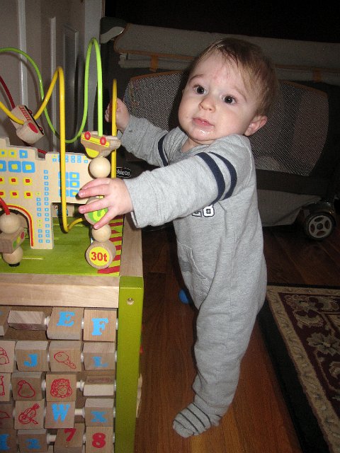IMG_2606b.jpg - He's using every toy and object around the house to pull himself up.
