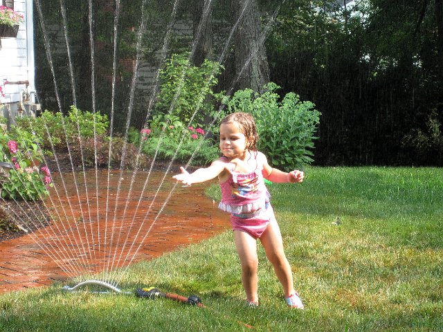 IMG_5431b.jpg - Catherine was getting braver and braver with the sprinkler.