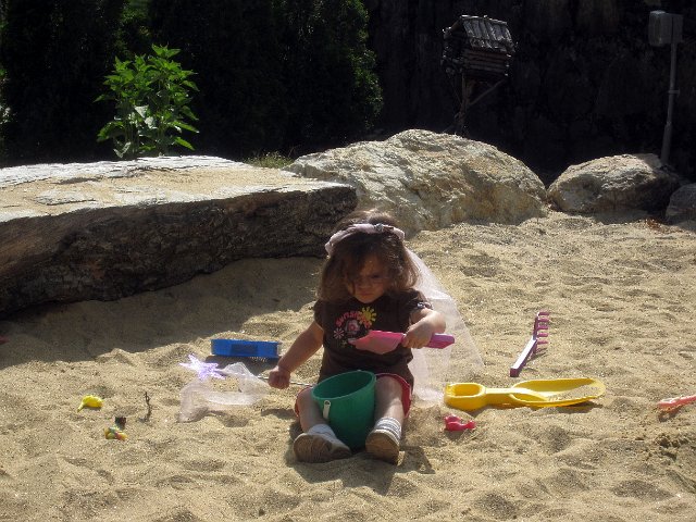 IMG_4016b.jpg - Catherine (wearing the fairy headpiece and wand that she had just made) dove into the sand pit for a bit.