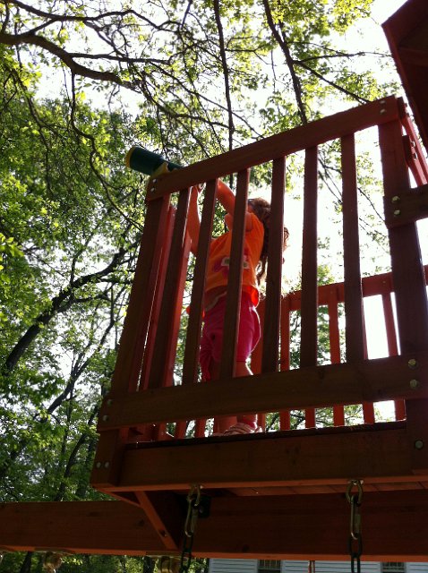IMG_0997b.jpg - Catherine is checking out the birds and trees using the telescope from the sky fort lookout tower.