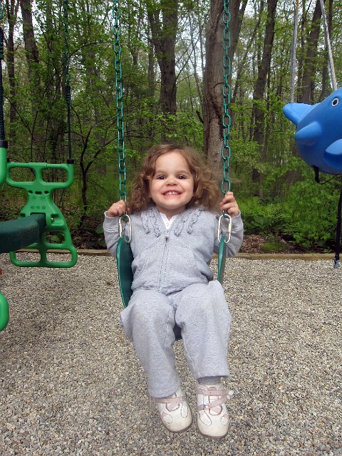 IMG_3752b.jpg - Catherine is even getting experience on a "big girl" swing and liking it.