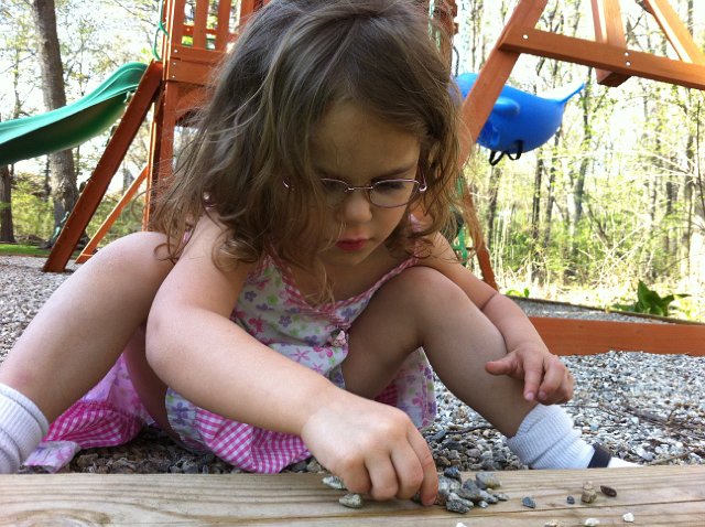 IMG_2080.jpg - Such concentration on a glorious spring day & she's singing the alphabet while aligning a stone for each letter as she goes.