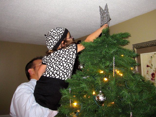 IMG_3260.jpg - Catherine had the honors of placing the star on our tree.