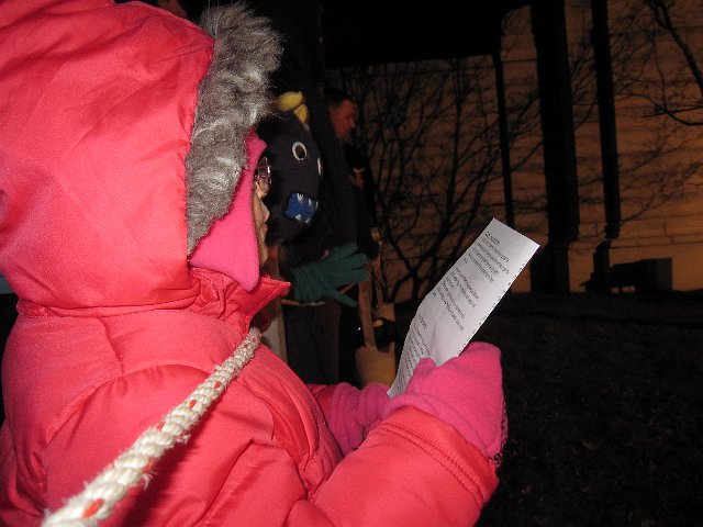 IMG_3299.jpg - Our little singer was excited to listen to the choir and tried to follow along.