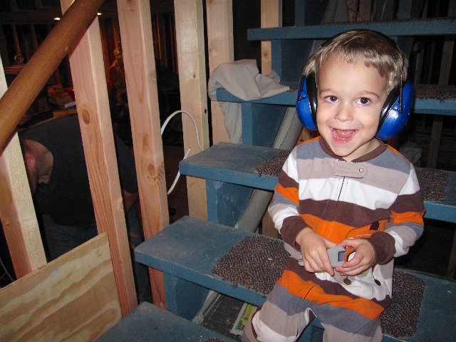IMG_3486.jpg - Nathan checking out Daddy's progress on the basement finishing project.