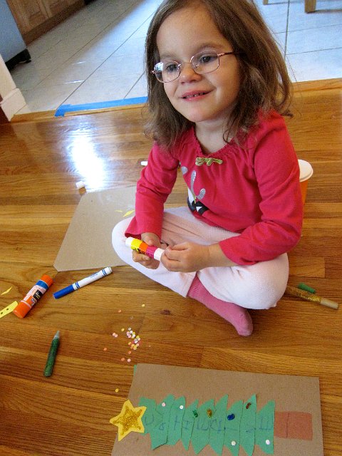 IMG_6115.jpg - This craft project was about cutting out shapes and building a tree with their names on it.