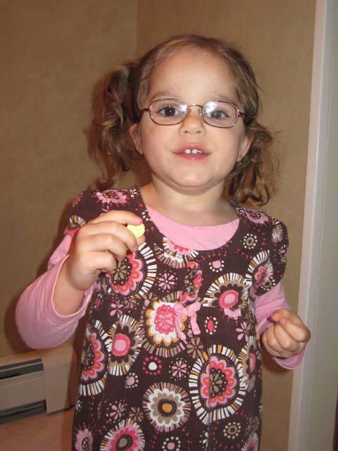IMG_8230.jpg - Our smart gal is reading the words on her valentine heart candy .. she seriously blows me away sometimes!