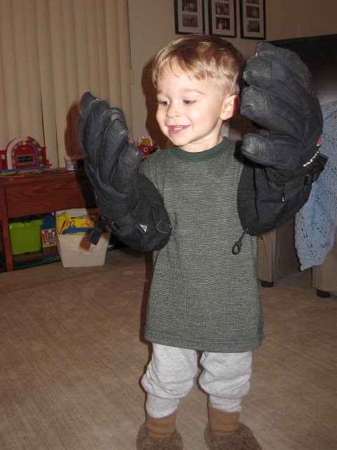 IMG_7946.jpg - Nathan admiring the gloves that his Daddy wears.