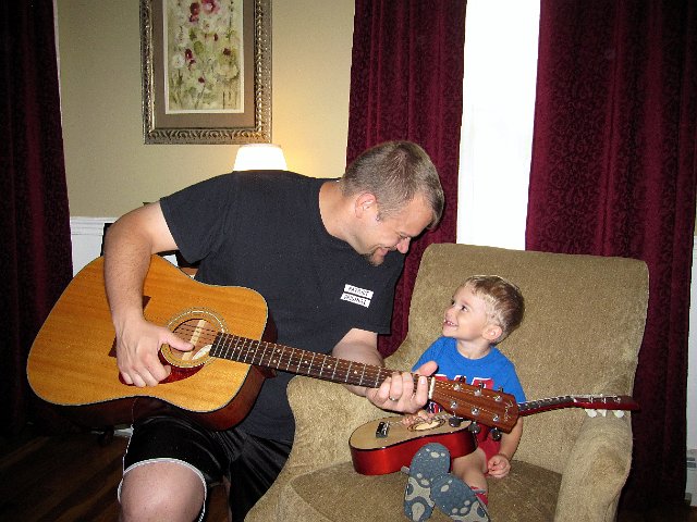 IMG_0889.jpg - Since receiving his guitar for his birthday, Nathan is often requesting "DaDa play big guitar".