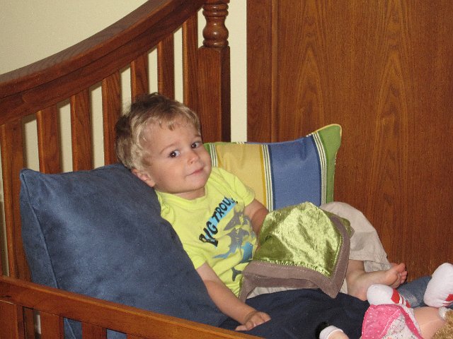 IMG_0414.jpg - Nathan was pretty excited and actually did very well in his new bed.  He's been admiring Catherine's bed with all the pillows for months. ... now he has his very own!