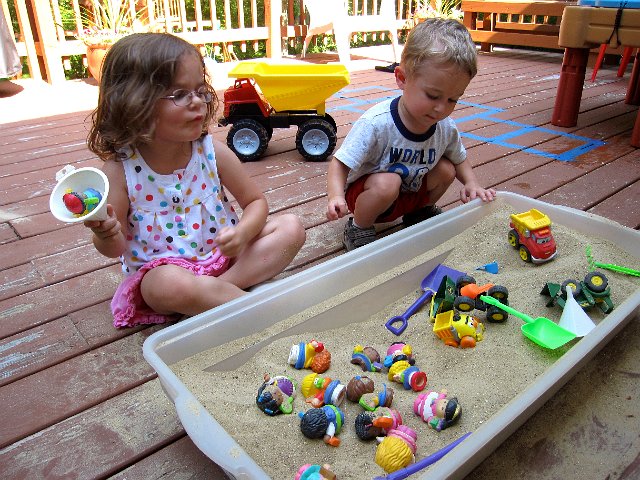 IMG_0636.jpg - We made our own little sandbox that's just the right size to fit on the deck in the late afternoon shade.