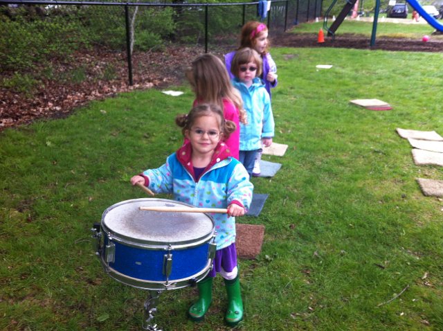 IMG_2099.jpg - Family Cooperative Preschool introduced Catherine to the snare drum thanks to one of her fellow classmate's older brother.
