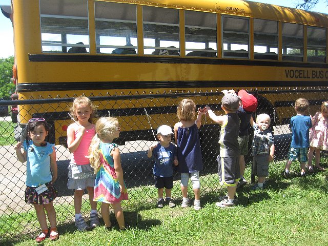 IMG_9954.jpg - Nathan follows the lead of the other students and waits his turn in line for boarding.