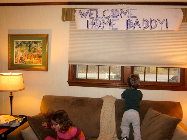 IMG_2837.jpg - The day has arrived, 12 days later, Daddy is home!!  Catherine is already racing off the sofa to the door.