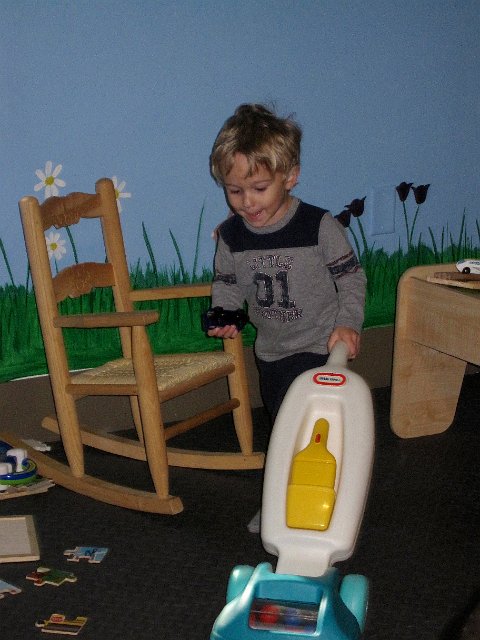 IMG_2871.jpg - Meanwhile, Nathan found a vacuum that he rarely parted with in the toddler play area.