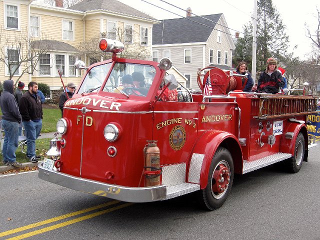 IMG_3075.jpg - We attended the 56th Annual Andover Firefighter's Holiday Parade where an old model fire truck led the way!  Inside this fire truck was the parade's grand marshall, Andover High School girls swim-and-dive team coach.