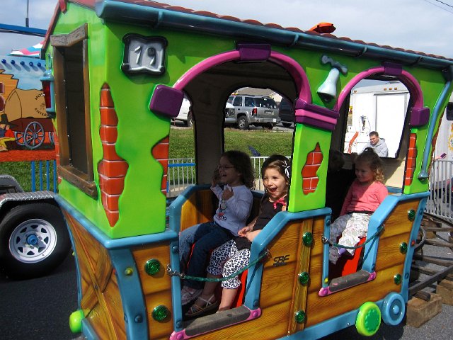 IMG_2316.jpg - Nathan made a little friend in the back of the train while Catherine and Kirra are having a blast in the front.