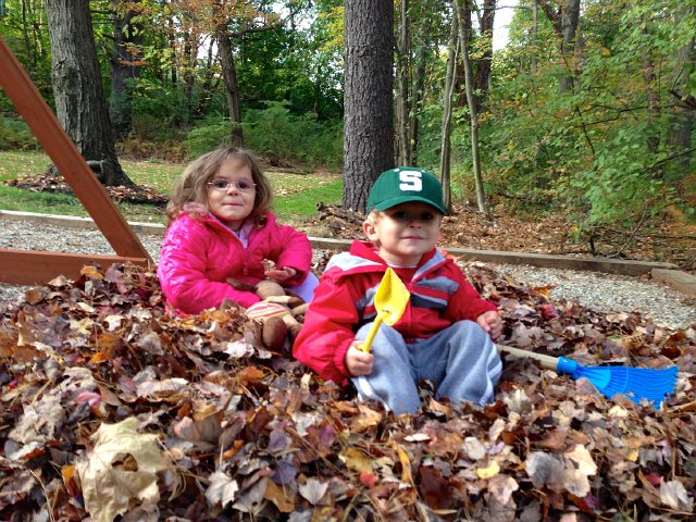 IMG_2596.jpg - We built a leave pile in the playground area so we could enjoy it a little longer and not damage the yard.