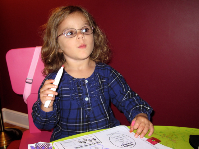 IMG_2067.jpg - Catherine is focused on solving her word puzzle.
