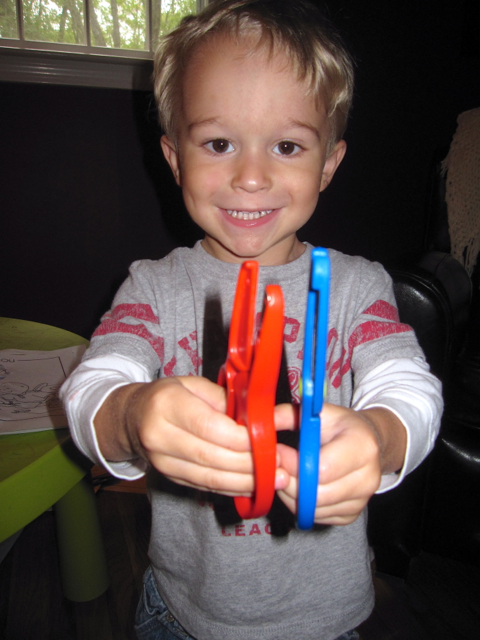 IMG_2070.jpg - While Nathan is just a little excited about his new scissors.
