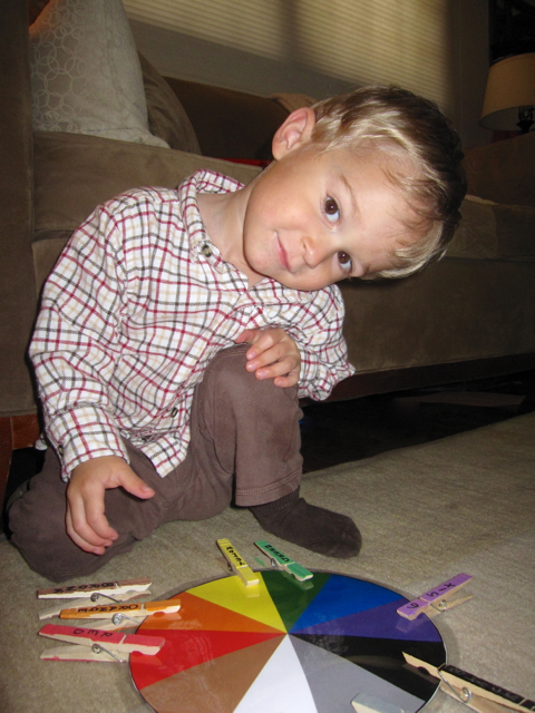 IMG_2162.jpg - Several Moms got together to create and exchange some Busy Activity Bags.  This color wheel was one of those items and Nathan can now practice his fine motor skills to operate the clothespin AND learn his colors and numbers.  FABULOUS IDEA!