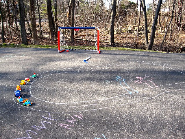 IMG_4795.jpg - The latest addition is the race track.  Catie Ann also added some spectators, too funny!