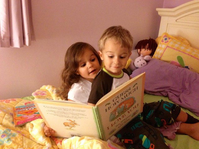 IMG_4012.jpg - A very touching moment ... I went to get Nathan's favorite truck and returned to the sight of him sitting on his sister's lap as she reads him their favorite story.