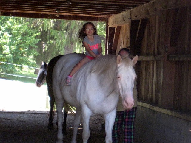 IMG_7502.jpg - Catherine was beyond excited to get out to the barn to see and then ride the horses.