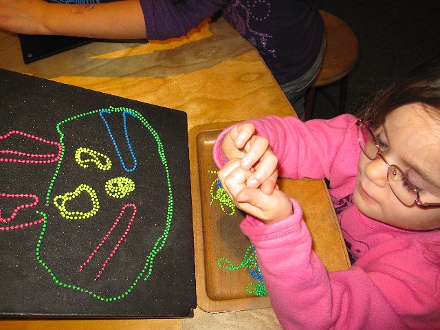 IMG_4092.jpg - Playing with magnetic beads in another hands-on discovery room.