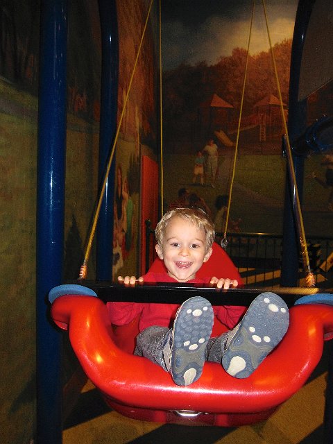 IMG_4100.jpg - The Science in the Park exhibit provided the chance to exercise your muscles on familiar playground equipment while using your thinking skills to solve movement and momentum challenges.  Two swings, each with different lengths of rope ... which one swings faster?