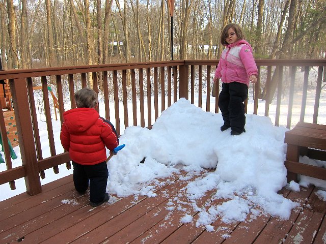 IMG_6715.jpg - Catherine is playing "Queen of the Mountain" on what remains of their igloo from the blizzard.