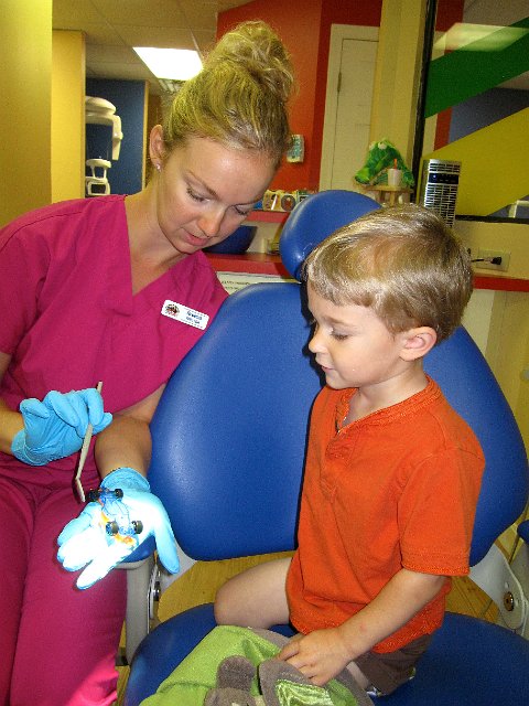 IMG_7030.jpg - The hygienist is easing her way in by getting Nathan's attention with his car.
