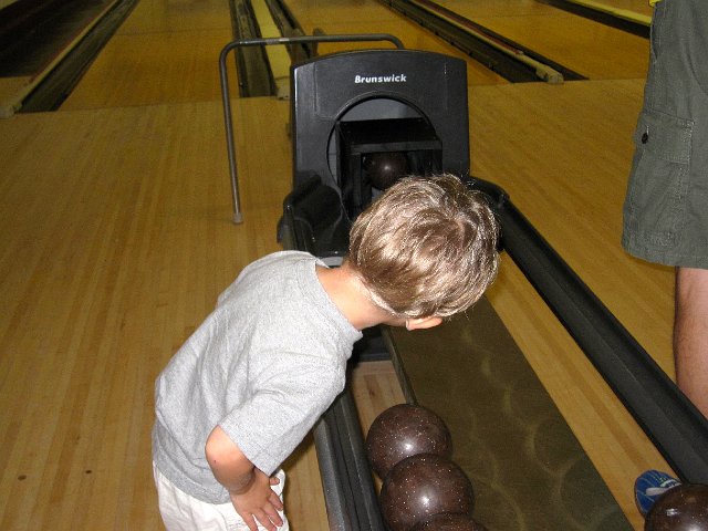 IMG_7177.jpg - Nathan is bewildered by the ball return and was lining up the balls for everyone throughout the game.