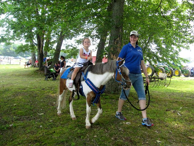 IMG_6616.jpg - The kids enjoyed a bouncy house, feeding goats, pony rides, tractor/train ride, etc.