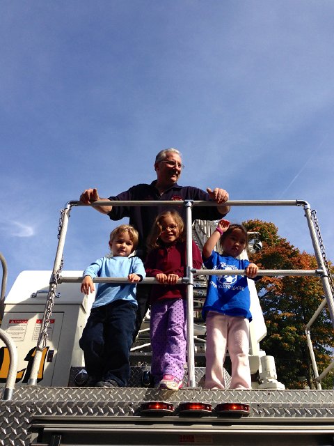 IMG_4784.jpg - Nathan, Catherine and Cali aboard the ladder truck.