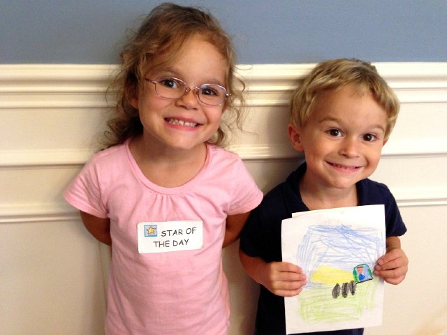 IMG_4142.jpg - A picture like this is hard to resist.  Star of the Day AND Catherine was excited to share with Nathan a picture she drew of him driving a truck.  Love those smiles!