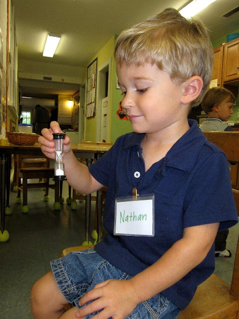 IMG_8089.jpg - Here he is learning about a tool to teach patience and fairness when waiting to use the chin up bar.
